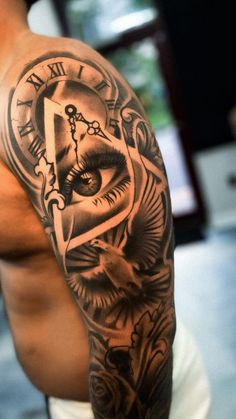 a man with a clock tattoo on his arm