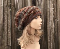 "Crochet Hat Style: Weekender Slouchy Hat - a slouchy beanie for women, men and teens. Color: This sample hat is shown in Chocolate Peacock, a mix of browns, rusts, golds and teals. Sizes: One size fits 20\" to 23\" (50.5 cm to 58 cm) head size. Fiber Content: 100% acrylic Characteristics: Chunky, very soft, warm and cozy. Care Instructions: Hand wash, dry flat. Every item from Pixiebell is handmade and knit or crocheted to order, unless otherwise stated in title of the item as \"ready to ship\". Production time may vary, please check the SHIPPING & POLICIES tab for accurate processing times. If you need an item promptly, please contact us so that we can make arrangements. While every effort is made to accurately represent the true colors of the yarns used in our work, your monitor setting Slouchy Cap For Outdoor, Slouchy Outdoor Cap, Slouchy Outdoor Fall Hat, Slouchy Brown Beanie Cap, Brown Bohemian Beanie One Size, Slouchy Fall Hat One Size, Brown Slouchy Beanie Hat, Slouchy Brown Beanie Hat, Warm Slouchy Brown Hat