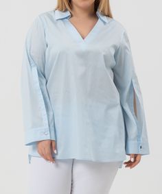 Lilou blouse is crafted from crisp 100% cotton, it features a spread collar merging seamlessly into a flattering V-neckline, it has long sleeves and button cuffs. Classic Fit. Material: 100% Cotton. Model wears size ‘S’. Chic Long Sleeve Blouse With Roll-up Sleeves, Fall V-neck Blouse With Placket, Chic Blouse With Roll-up Long Sleeves, Chic Long Sleeve Blouse With Roll-up Option, Spring V-neck Blouse With Button Cuffs, V-neck Shirt With Placket For Spring, V-neck Shirt With Button Cuffs For Daywear, Chic Long Sleeve Tops With Roll-up Sleeves, V-neck Tops With Button Cuffs For Daywear