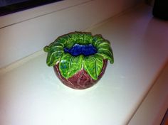 a ceramic potted plant sitting on top of a counter