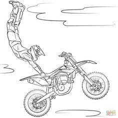 a person on a dirt bike jumping in the air with his hand up to the ground