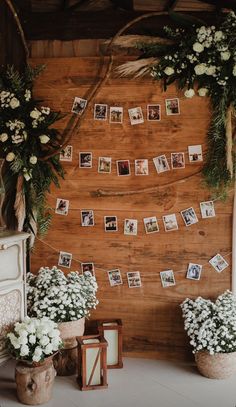 a wooden wall decorated with photos and flowers