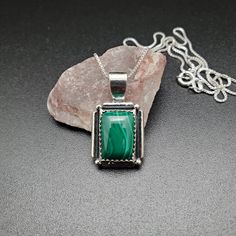 Visit our on-line shop at: Etsy.com/shop/AlbuquerqueDesigns *sterling silver necklace pendant *rectangle shape pendant with silver box chain necklace 18 inches long *southwestern jewelry *green malachite / green stone with matrix *calibrated pre-cut stones in millimeter and shape of stone: 14x10nn rectangle shape *back of jewelry items are all covered / do not show the back of stones *all jewelry items are made to ship, slight variations in stones will occur comparing to pictures. *size of a pen Green Sterling Silver Rectangular Pendant, Green Sterling Silver Rectangular Pendant Jewelry, Green Sterling Silver Jewelry With Rectangular Pendant, Green Rectangular Sterling Silver Jewelry, Silver Sterling Silver Necklace With Rectangular Stone, Spiritual Sterling Silver Rectangular Jewelry, Sterling Silver Rectangular Gemstone Necklace, Rectangular Sterling Silver Necklace With Gemstone, Sterling Silver Necklace With Rectangular Stone