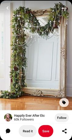 an old mirror is decorated with greenery and garland for the holiday season to be