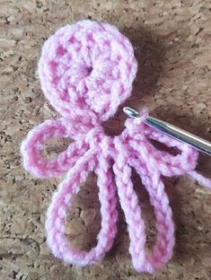 a crocheted object with a metal hook