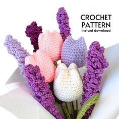 crochet flowers are arranged in a bouquet