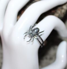 Elevate your Halloween look with our exquisite Spider Halloween Ring. Crafted with intricate detail and luxurious materials, this stunning piece is sure to add a touch of sophistication to any spooky ensemble. Metal :-  Silver Style : Insect Your order will be handmade and ready for shipment in 1 to 3 business days https://www.etsy.com/shop/RivikaDesigns Fantasy Rings For Halloween Gift, Unique Silver Rings For Halloween, Silver Rings As Halloween Gift, Unique Metal Rings For Halloween, Silver Rings For Halloween Gift, Unique Halloween Jewelry, Unique Collectible Halloween Jewelry, Elegant Rings As Halloween Gifts, Elegant Rings For Halloween Gifts