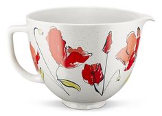 a white bowl with red flowers painted on the side and inside, sitting in front of a white background