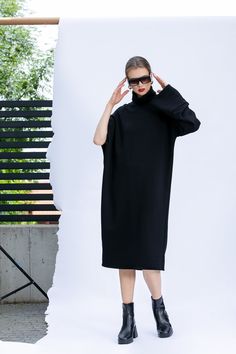 Loose Fit Midi Dress, Plus Size Dress, Warm Sweater Dress in Black 🍒 Unique Oversized Turtleneck Sweater Dress for Spring Summer Season cut in a lovely cotton sweatshirt fabric which drapes effortlessly. Use a tie-fastening belt to define the fit. Roll the sleeve and make it with 3/4 sleeve. Style it with moto boots, sandals or sneakers. 🍒 Length : 115 cm / 45.2 in 🍒 Fabric : Cotton Sweatshirt Fabric 🍒 Please take a look at our size chart to ensure perfect fit at the pictures above 🍒 We acc Oversized Dresses For Fall Daywear, Oversized Knee-length Winter Dresses, Oversized Long Midi Dress For Winter, Oversized Winter Midi Dress, Winter Turtleneck Oversized Dress, Black Winter Dress, Long Sleeve Dress Maxi, Oversized Turtleneck Sweater Dress, Oversized Sweater Dress