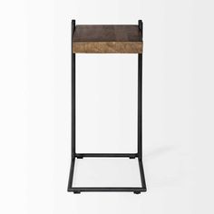 the side table is made from metal and wood, with a square wooden shelf on one end