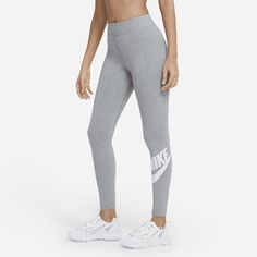 The perfect complement to your favorite tops and tees, the Nike Sportswear Leggings have a high-rise design and a stretchy waistband that sits above your navel. The soft, cotton blend wicks sweat, making these full-length leggings an easy choice for everyday wear. Grey Nike Leggings, Legging Adidas, Thermo Leggings, Sportswear Leggings, Graphic Leggings, Leggings Nike, Nike Leggings, Running Leggings, Grey Nikes