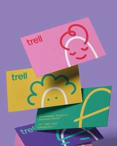 four different colored business cards stacked on top of each other with the words trell