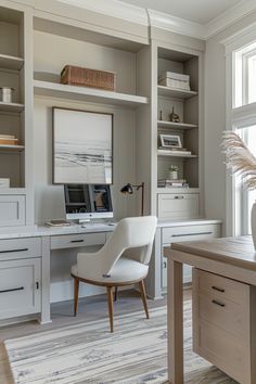 a home office with built - in shelving, desk and chair by the window