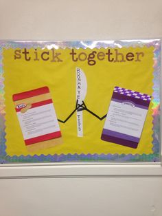 a bulletin board with two pieces of paper taped to it and the words stick together