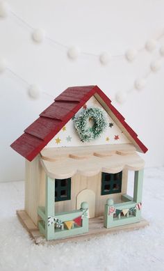 a small wooden christmas village with the words diy patterned christmas village