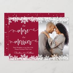 a red and white holiday photo card with snowflakes on the front, featuring an image of a man and woman