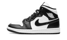 The Women’s Air Jordan 1 Mid “Panda” is a women’s-exclusive colorway of the lifestyle shoe with a versatile look.  The ever popular “Panda” theme lands on the Jordan 1 Mid and, like the Jordan 1’s high and low-top styles that are also offered in the colorway, the results are quite favorable.  The shoe has a white leather upper with black leather overlays and a black leather Swoosh.  A white “Wings” logo appears on the collar and white Jumpman and “Air” detailing are found on the tongue tag.  Und Womens Air Jordan 1, 70s Converse, Womens Air Jordan, Panda Shoes, Nike Noir, Nike X Travis Scott, Converse Run Star Hike, Converse Run Star, Jordan 2