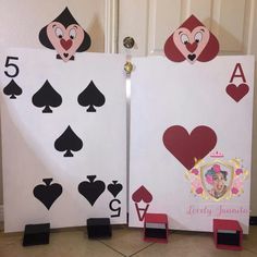 two playing cards made to look like queen and spades