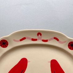 a plate with two birds painted on it