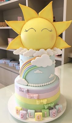 a cake that is sitting on top of a table with the sun in the middle