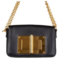 Tom Ford 'Natalia' crossbody bag in black calfskin featuring flap top with oversized gold-tone turn-lock closure. Slit pocket on the back side. Lined in black microfibre with one zipper pocket against the back. Has been carried and is excellent condition. Height 16cm (6.2in) Width 23cm (9in) Depth 6cm (2.3in) Drop of the Handle 27cm (10.5in) Shoulder Strap Length 112cm (43.7in) Hardware Gold-Tone Balenciaga Purse, Ruffles Bag, Tom Ford Leather, Celine Shoulder Bag, Python Bags, Ford Black, Snake Skin Bag, Chanel Shoulder Bag, Handbag Heaven