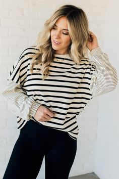 Stay warm and stylish in our Women's Double Stripe Thermal Top. Made with soft and textured knit fabric, this top features a round neckline and contrast sleeves for a unique touch. Perfect for any occasion, this top will keep you comfortable and on-trend. 96% Cotton 4% Spandex SIZING: Model is 5'4" wears a size 5 and is modeling the Small. Small 2-4 Medium 6-8 Large 10-12 MEASUREMENTS: SIZE BUST SLEEVE LENGTH Small 45" 15.5" 24.5" Medium 47" 16" 25.5" Large 49" 16.5" 26" Ships from Utah within 1 Lounge Wear Sets, Poncho Tops, Thermal Top, Jumpsuit Shorts Rompers, Short Jumpsuit, Knee Length Dresses, Textured Knit, Cardigan Jacket, Dresses With Leggings