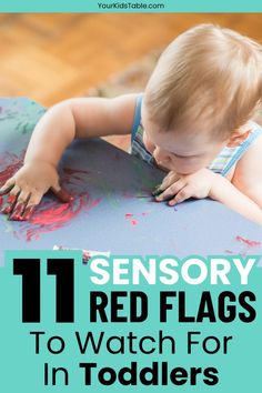 a toddler playing with red flags on a blue mat and text that reads, 11 sensory red flags to watch for in toddlers