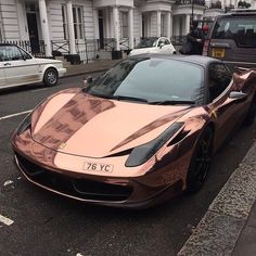 a pink sports car parked on the street