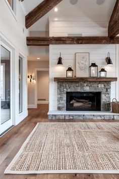 a living room filled with furniture and a fire place in the middle of a room