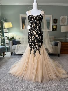 This gorgeous Custom Black and champagne Trumpet/ Slightly Mermaid Wedding Dress with a sweetheart neckline is a total stunner! It includes a removable cape veil, a structured bodice, layers of tulle on the train and beautifully dispersed black lace all over. The lace up back adds such a whimsical touch to it too!  It can be custom made in any size and color preference. You can see the video of the dress here https://www.instagram.com/p/C2BdK3ZOBcQ/ Wedding Dress With Cape Veil, Wedding Dress With Black Lace, Gothic Quinceanera, Wedding Dress With Black, Custom Wedding Dress Sketch, Champagne Wedding Gown, Wedding Dress With Cape, Champagne Wedding Dress, Cape Veil