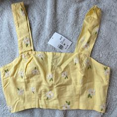 Forever 21 Cropped Tank Top. Yellow With White Embroidered Flowers. Size Medium. New With Tags. Let Me Know If You Have Any Questions!! Trendy Yellow Crop Top By Forever 21, Forever 21 Floral Embroidery Fitted Tops, Forever 21 Yellow Cotton Top, Forever 21 Floral Print Crop Top, Forever 21 Fitted Floral Print Crop Top, Embroidered Crop Tops, Flowers Color, Forever 21 Tops, Crop Tank