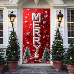 christmas decorations are displayed in front of a red door with the word merry written on it