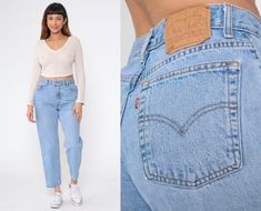 Vintage 90s jeans by Levis 550 with a high waist, a relaxed fit, and a tapered leg. Please see measurements and condition below. Every garment we sell is authentic vintage! You will receive the exact item photographed. Condition: Very good vintage with light general wear. Best fits women's: Labelled 10S (short). Waist measures 30" Tag: Levi's 550 Material:  Denim MEASUREMENTS Taken from seam to seam while the garment is lying flat. Double the armpit, waist, and hips For reference, model is 5'9" Levi 550 Jeans Women, Levi’s Mom Jeans, Jean Levis, 90s Levis, Levis 550 Jeans, Blue Denim Pants, 90s Jeans, Levis 550, Short Waist