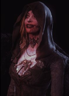 a woman with blood on her face wearing a hoodie