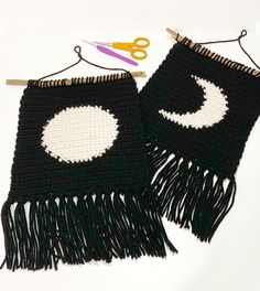 two black and white crocheted bags with scissors