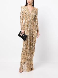 Jenny Packham Gazelle sequin-embellished Gown - Farfetch Gold Long Sleeve Evening Dress For Formal Occasions, Gold Long-sleeve Evening Dress For Gala, Gold Long Sleeve Gala Evening Dress, Gold Long Sleeve Evening Dress For Gala, Gold V-neck Sequin Dress For Formal Occasions, Gold Sequin Dress For Gala And Formal Events, Luxury Sequin V-neck Evening Dress, Luxury V-neck Evening Dress With Sequins, Gold Embellished V-neck Sequin Dress