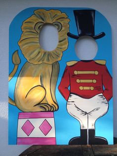 a door hanger with a painting of a dog and a lion on it