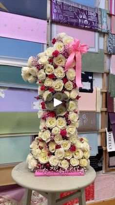 a very tall cake made out of flowers