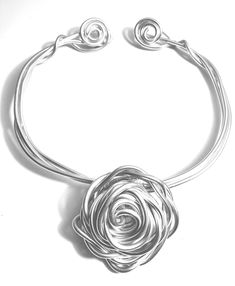 Necklace with intertwining spirals and a rose.   Elegant, charming and beautifully handcrafted.    Light and easy to wear.  Stunning with a casual jean and shirt look or a date night ensemble.  Gorgeous with a black turtle neck or a colorful summer dress. The necklace can be dressed up or down.  Soft and super light.  Simply molds to fit any size. How To Make Letters, Colorful Summer Dresses, Black Turtle Neck, Doll Jewelry, Diy Wire Jewelry, Rose Necklace, Conch Shell, Conch, A Rose