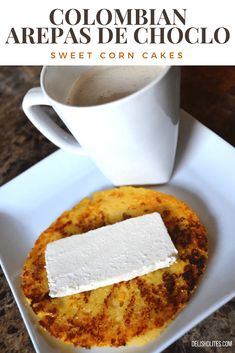 a close up of a plate of food with a cup of coffee in the background