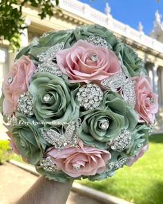 a bridal bouquet with pink and green flowers