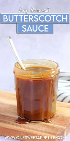 an easy homemade butterscotch sauce in a glass jar with a spoon on a cutting board