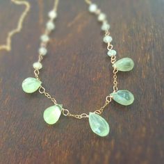 This necklace is made of green prehnite gemstones, gold filled: chain, spring ring clasp and findings. This necklace measures 18 inches in length. All of our jewelry arrives wrapped and ready for giving! All of our jewelry is unique and custom designed. Most of our jewelry can easily be resized. If there is a piece of jewelry that you are interested in, but would like some changes made, please do not hesitate to contact us. We appreciate your shopping with Jewelry by CARMAL and hope you will do Prehnite Gemstone Beads Necklace For Gift, Gold Prehnite Jewelry As A Gift, Green Briolette Wire Wrapped Jewelry, Sugar Land, Gold Chain Jewelry, Jewellery Gold, Necklace Green, Gemstone Jewellery, Chain Jewelry