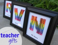 two framed art pieces with the word m and m spelled in crayon pencils