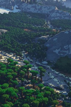 an aerial view of a river and mountains