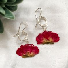 These stunning real flower earrings are handmade by myself with love and dedication. Every flower is carefully preserved in resin.  They make a perfect and special gift for a loved one, or for your wonderful self because we all deserve to feel beautiful. Free shipping worldwide! Purchase more than one pair for a free upgrade to express shipping!  -Each delicate flower is coated by hand with no moulds used, and the flowers are sourced locally and ethically.  -The flowers are all unique, as nature Rose Red Flower Earrings For Valentine's Day Gift, Silver Sterling Flower Earrings With Pressed Flowers, Silver Earrings With Pressed Flowers For Wedding, Delicate Sterling Silver Birth Flower Earrings, Silver Wedding Earrings With Pressed Flowers, Silver Sterling Silver Earrings With Pressed Flowers, Wedding Silver Earrings With Pressed Flowers, Silver Pressed Flowers Drop Earrings, Silver Botanical Earrings For Gift