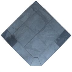 a black square shaped tile on a white background