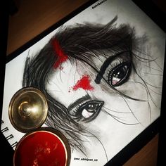 a drawing of a woman's face with blood on the floor next to it