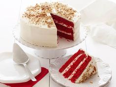 two slices of red velvet cake with white frosting