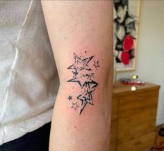 a person with a star tattoo on their arm